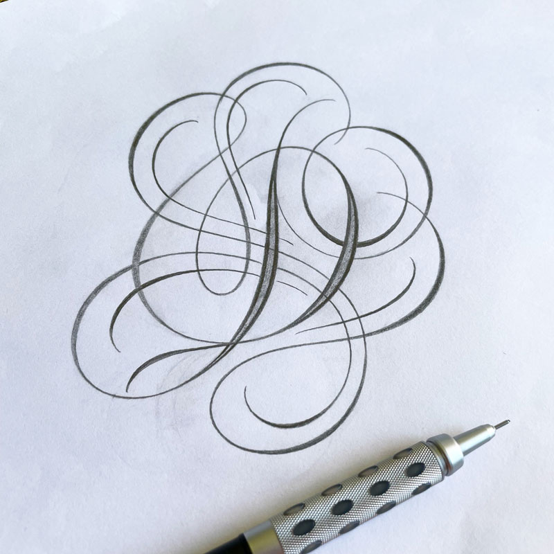 Letter D with cloudy flourishes surrounded